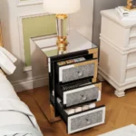 Modern crystal nightstand with drawers featuring mirrored finish and diamond details in a glamorous bedroom setting