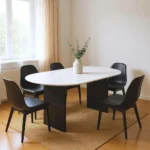 72-inch white and black marble oval dining table with solid wood sled base in a dining room setting