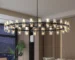 48-inch matte black chandelier with modern crystal accents hanging above a dining table