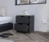 Two drawer nightstand with black wengue finish next to a bed