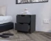 Two drawer nightstand with black wengue finish next to a bed