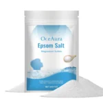 OceAura jasmine and rose scented bath salts in a glass jar with wooden lid, placed on a bamboo tray with white towel