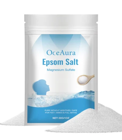 OceAura jasmine and rose scented bath salts in a glass jar with wooden lid, placed on a bamboo tray with white towel