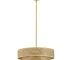 Woven rattan ceiling light in a modern boho living room with warm glow