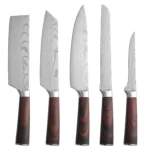 Five-piece Japanese kitchen knives set including paring, boning, butcher, bread, and chef knife on cutting board
