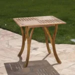 Acacia wood outdoor dining table square 31.5 inch natural brown finish on patio