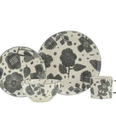 Elegant floral dinnerware set with gray and ivory ceramic plates and bowls arranged on a wooden table