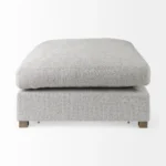 Goldoma light gray fabric cocktail ottoman with brown wood frame in living room