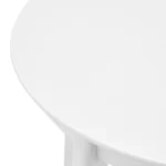 Goldoma 36-inch round dining table with white wood top and sintered stone finish, showcasing industrial design in a home dining setting
