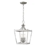 HMS vintage ceiling light hung above a wooden dining table in a cozy living room, casting soft ambient light.