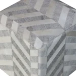 Goldoma gray and ivory hair on hide chevron pouf ottoman in a living room setting