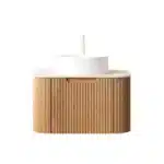 Side angle of the floating bathroom vanity with striped curved edges, showing the depth and the white basin against a