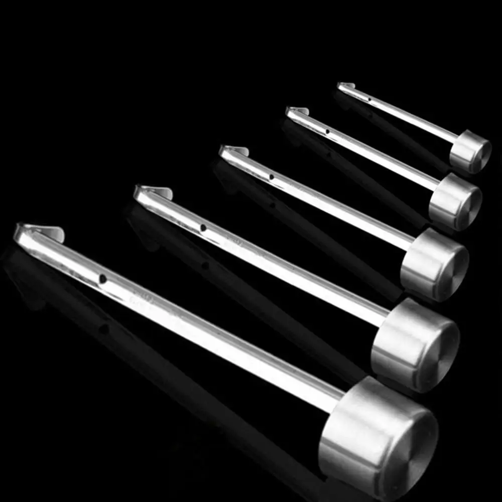 Stainless steel measuring cup with hook hanging on a kitchen rack