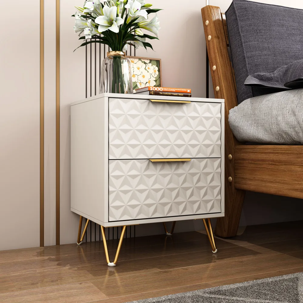 Modern nightstand with drawers, gold legs, and 3D embossed design in a bedroom setting