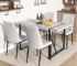 Modern dining table small rectangular gray wood with four chairs in a cozy dining room