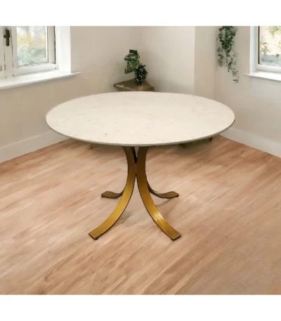Goldoma 48 inch ivory marble dining table with brass pedestal base in a modern dining room