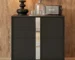 Modern mirrored nightstand with mirrored drawer front and metal legs in a bedroom setting