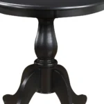 30 inch round dining table with black pedestal base in a modern dining room
