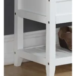 White storage bench with padded seat and shoe shelf in entryway