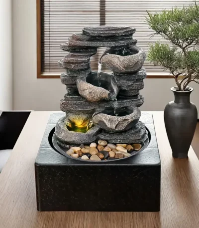 Goldoma 10-inch 3-tier LED tabletop fountain with cascading waterfall, realistic stone texture, USB-powered, on a