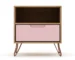 Pink nightstand with wooden frame and metal legs in a cozy bedroom setting