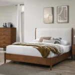 Adjustable full size bed with walnut panel headboard and beige upholstery featuring diamond crystal design and oak slat support