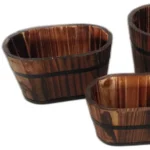 Brown wooden garden planter set with three planters arranged on a patio