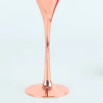 Elegant crystal champagne glasses set on a table with sparkling wine