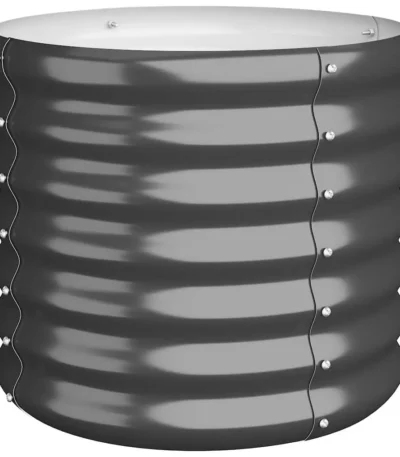 Large anthracite powder-coated steel garden planter on a patio floor, filled with lush green plants, side view showing