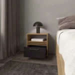 Natural oak nightstand with drawer and open shelf in a minimalist bedroom setting