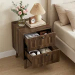 Modern double drawer nightstand with solid wood legs in walnut finish against a bedroom wall