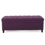 Purple fabric storage ottoman with hidden compartment and birch wood legs in a living room