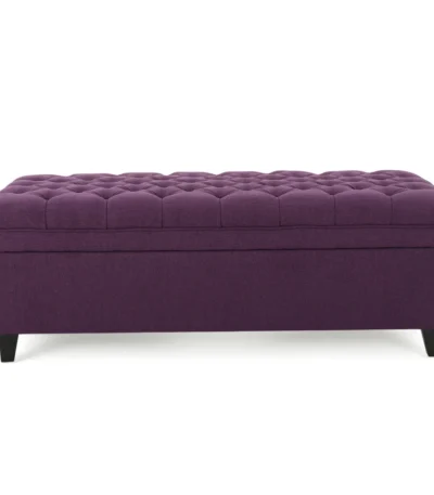 Purple fabric storage ottoman with hidden compartment and birch wood legs in a living room