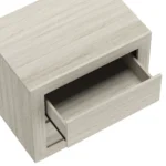 Whitewashed oak nightstand with two drawers in modern minimalist style beside a bed in a bedroom