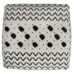 White cotton chevron pouf ottoman with storage in modern bedroom setting