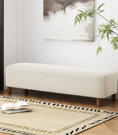 Modern upholstered ottoman bench with wood legs in neutral tones, perfect for seating or decor