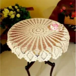 Vintage lace table mats in shabby chic style on a wooden table