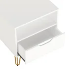 White nightstand with gold legs featuring a drawer and open shelf on glossy finish