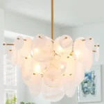 Vintage gold chandelier hanging over a dining table with warm glow