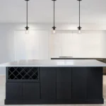 Modern pendant light in a kitchen island setting, illuminating the countertop with warm light.