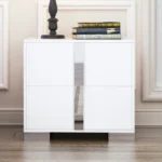 Modern mirrored nightstand with mirrored drawer front and metal legs in a bedroom setting