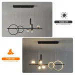 Black and gold linear chandelier viewed from below, highlighting the sleek metal finish
