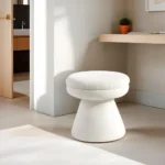 Adjustable velvet mushroom ottoman in a modern living room setting, plush round seat with wooden legs