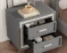Mid century nightstand with velvet drawers in a cozy bedroom setting