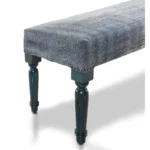 47-inch upholstered bench with blue and cream abstract pattern and blue legs in a living room
