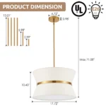 Modern chandelier with white fabric shade and brass finish hanging over kitchen island