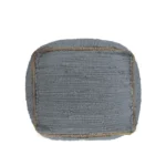 Goldoma foldable cube pouf ottoman in gray cotton with natural jute braid, placed in a living room as a footrest