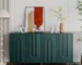 Modern green sideboard cabinet with four doors in a living room setting