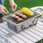 Modern square fire pit with wood burning in a patio garden setting