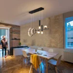 Side view of the 48W linear pendant light with remote, showing adjustable height cables